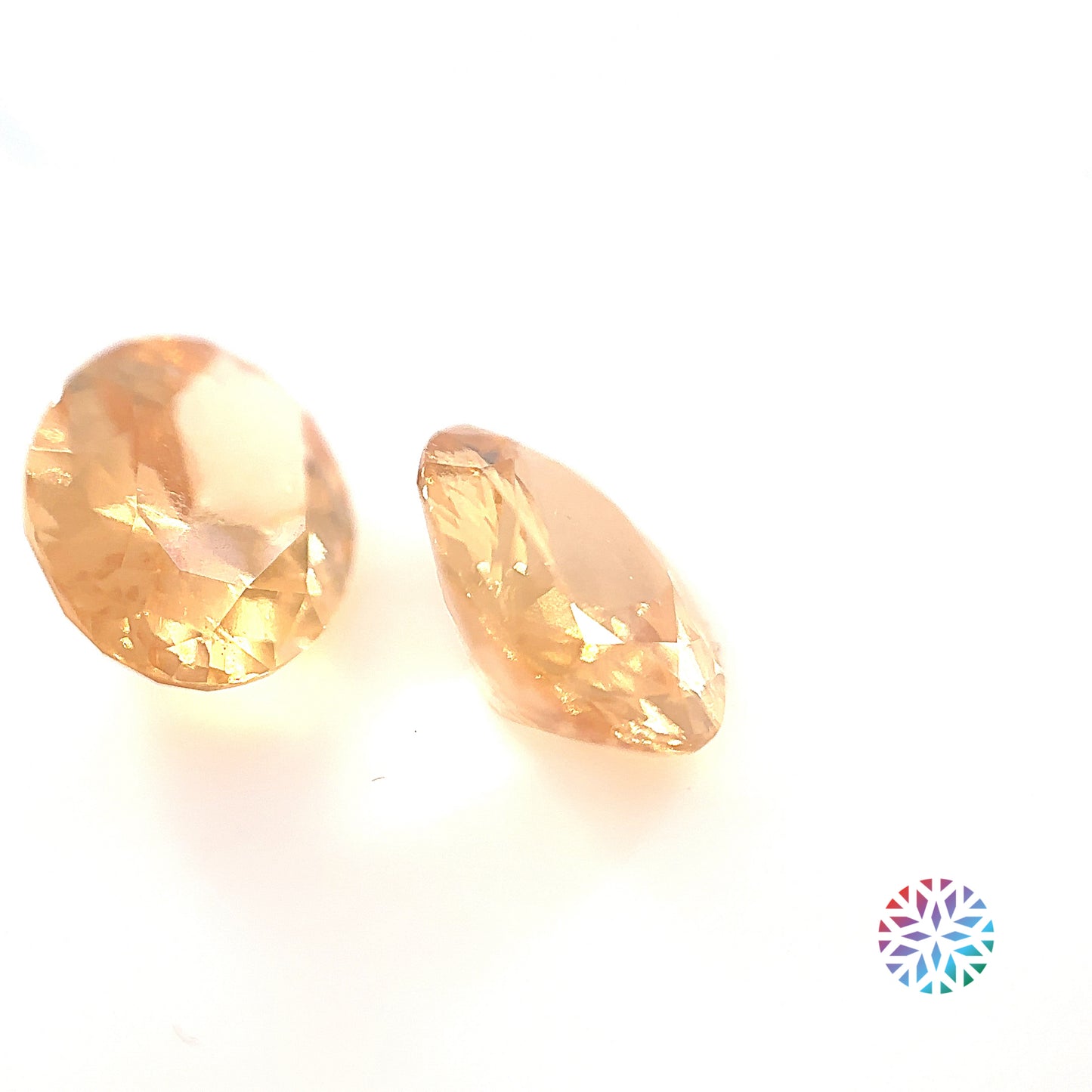 Golden Hessonite pair - Oval, 9.46ct, 12.8 x 9.5mm